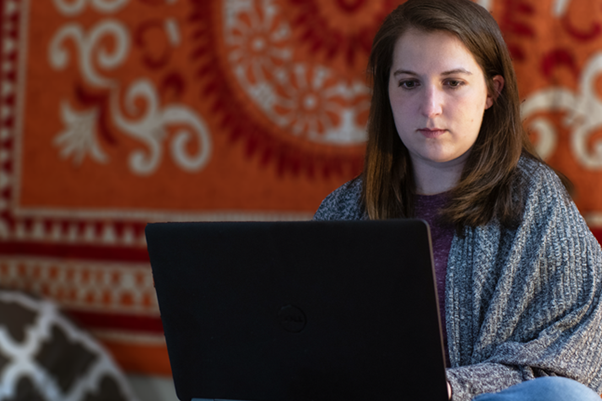 A student working on a laptop