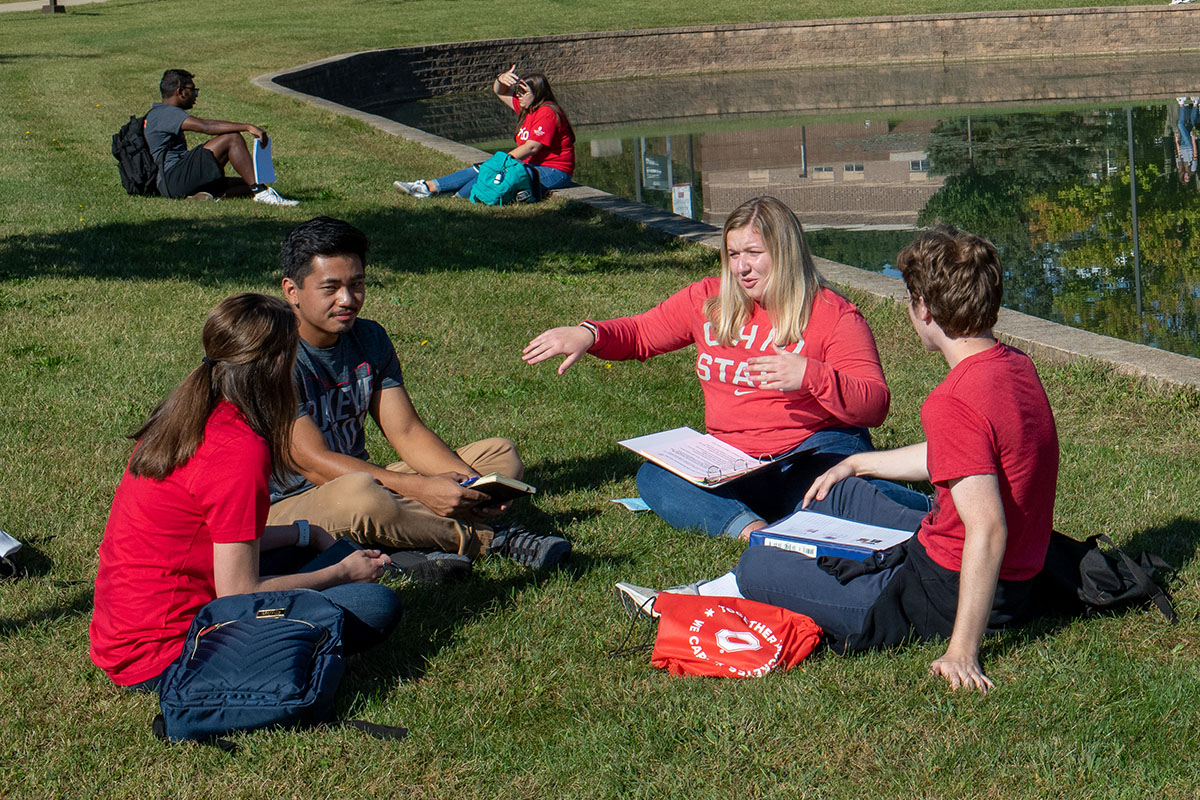 Students talking in a study group outside by a pond at The Ohio State University at Marion